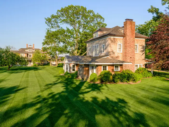 The backyard is huge and private, with tall trees to keep out any prying eyes.