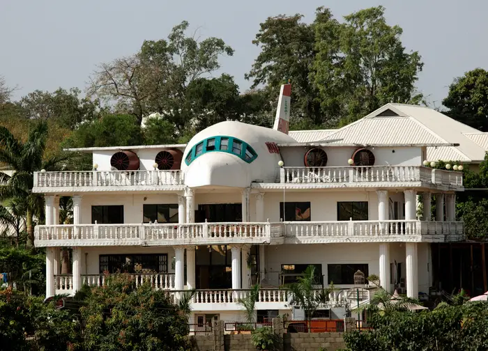 This home in Nigeria was partially designed in the shape of an aeroplane. It’s in the city of Abuja, and was created by a couple to display their love for traveling. There’s a kitchen and computer room in the “plane” part of the house.