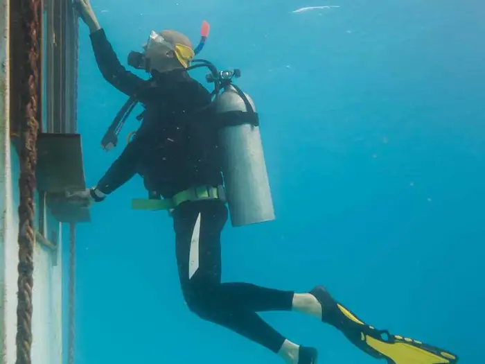 To get a clear shot into the room from underwater,  Anhede used a squeegee to clean the windows.