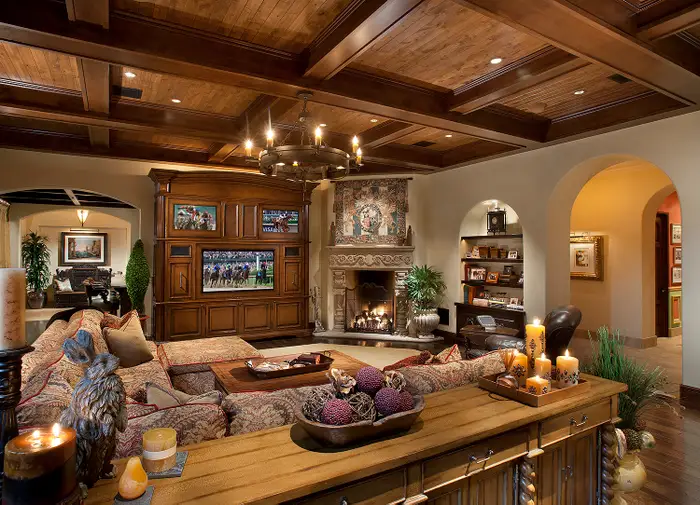 and-overlooks-the-homes-great-room-with-a-wood-beamed-ceiling-and-gas-fireplace