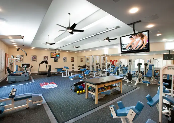 1,746-square-foot custom-designed gym. It comes complete with a locker room, showers, and commercial-grade fitness equipment.