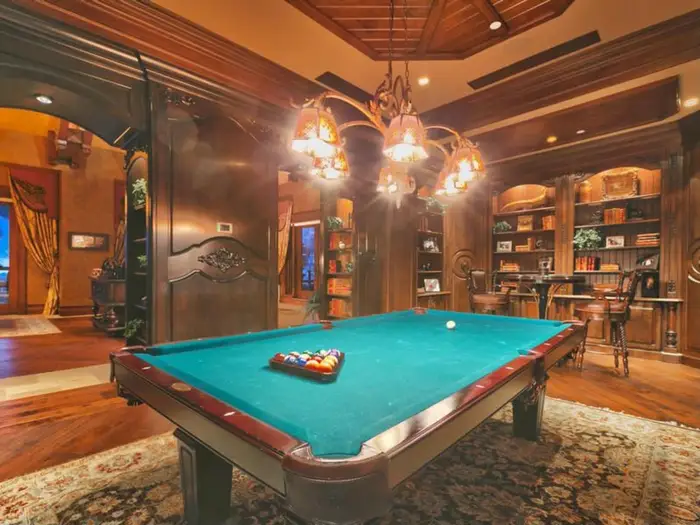 A pool table in the game room