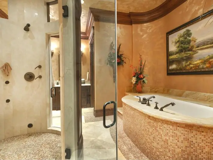 And here is the master bath with a soaking tub, steam shower, and his and hers sinks