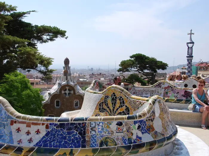 Parc Güell is a public park filled with eclectic sculptures, landscaping, and monuments