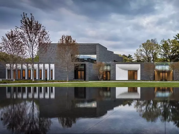 The new Garden Mausoleum at Minneapolis’ Lakewood  Cemetery uses a cool palette of stone, bronze, glass