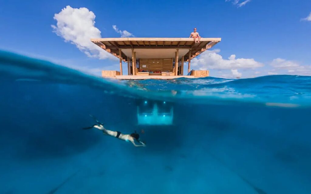 Licking his camera lens really helped Anhede get a clear  shot of the hotel room above and below the surface of the water.